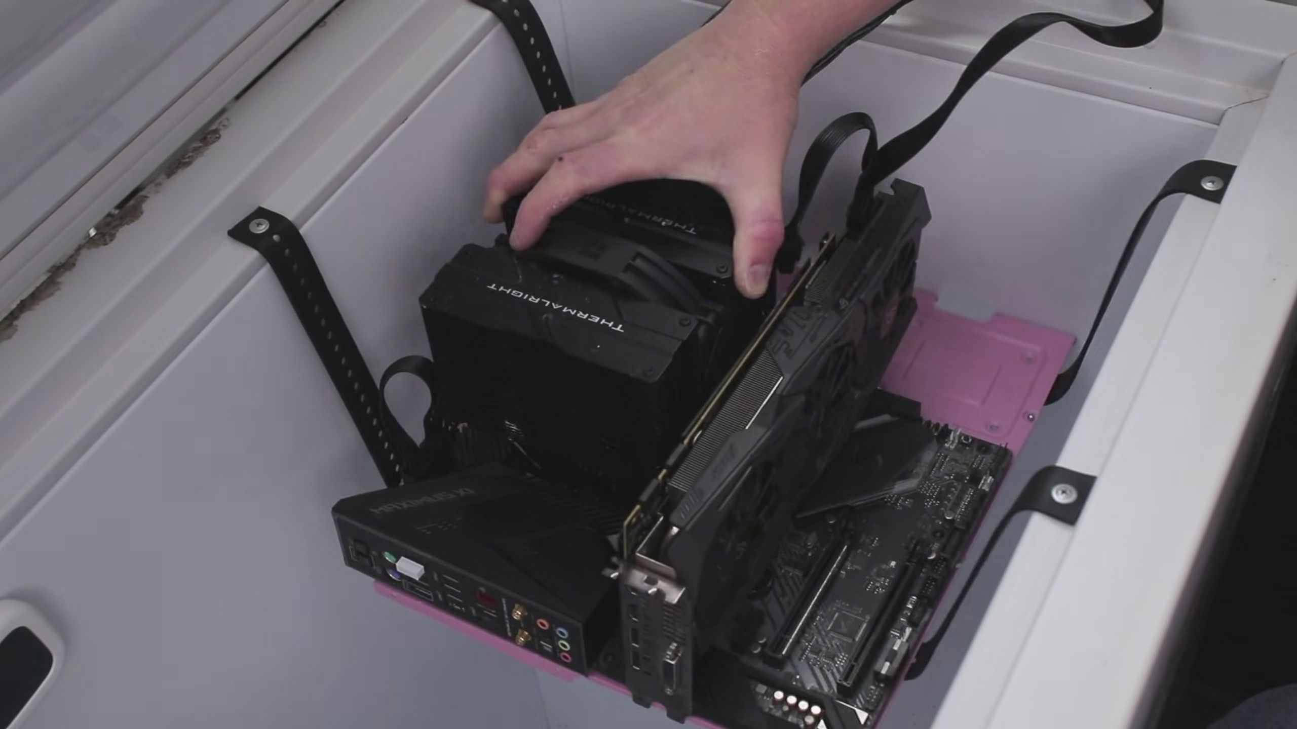 Australian modder solves PC in a freezer conundrum with sheer size, socks filled with silica gel powder — condensation conquered and minimal overclocking gains 