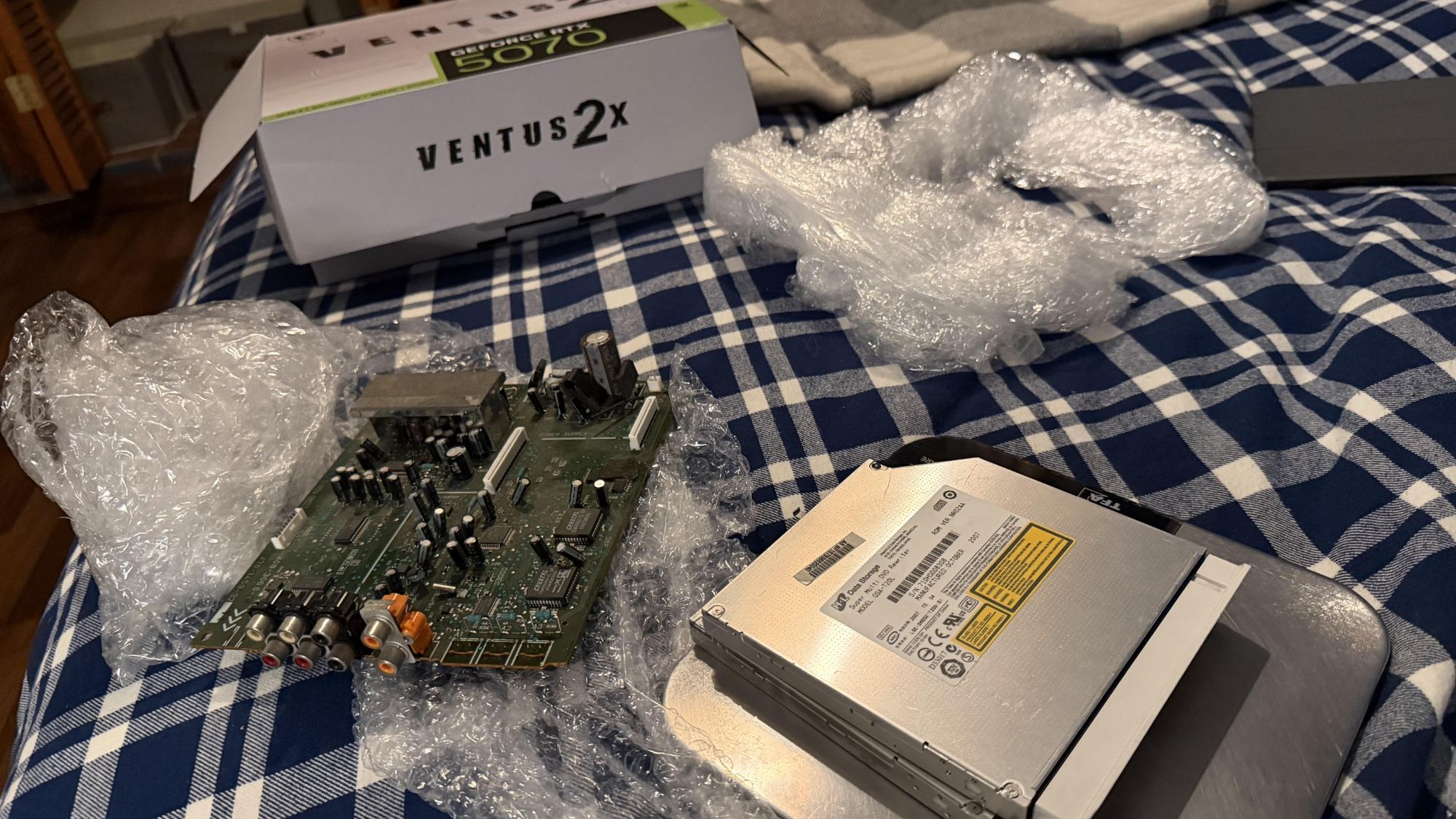 Unlucky PC builder sent RTX 5070 from Amazon, gets DVD rewriter and a busted logic board from an early 2000's Kenwood AV receiver instead — $700 GPU turns out t