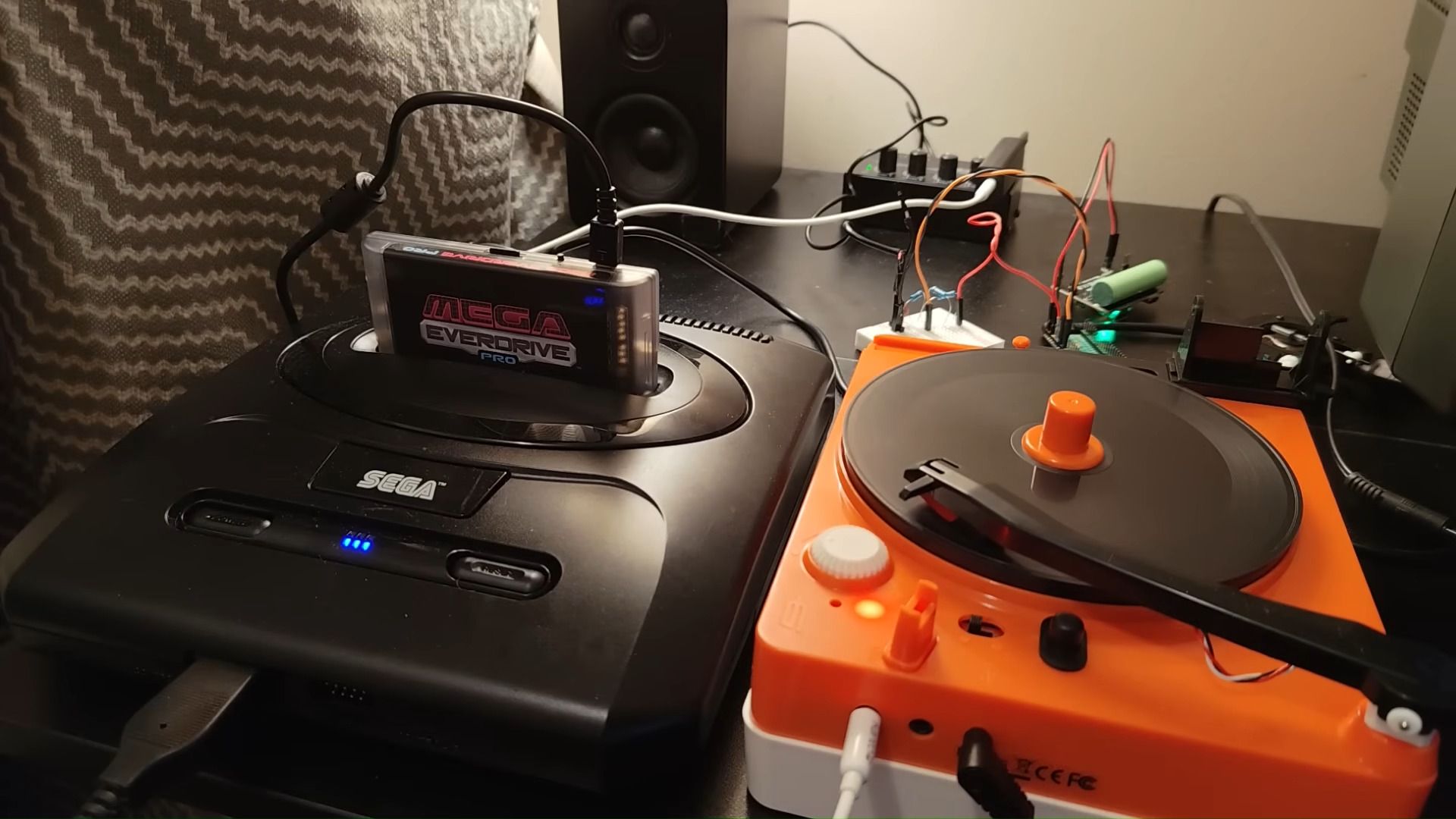 Retro gaming enthusiast attempts loading games to Sega Genesis from a vinyl record player, recording game data as sound — Mega EverDrive Pro and Pi Pico 2 board